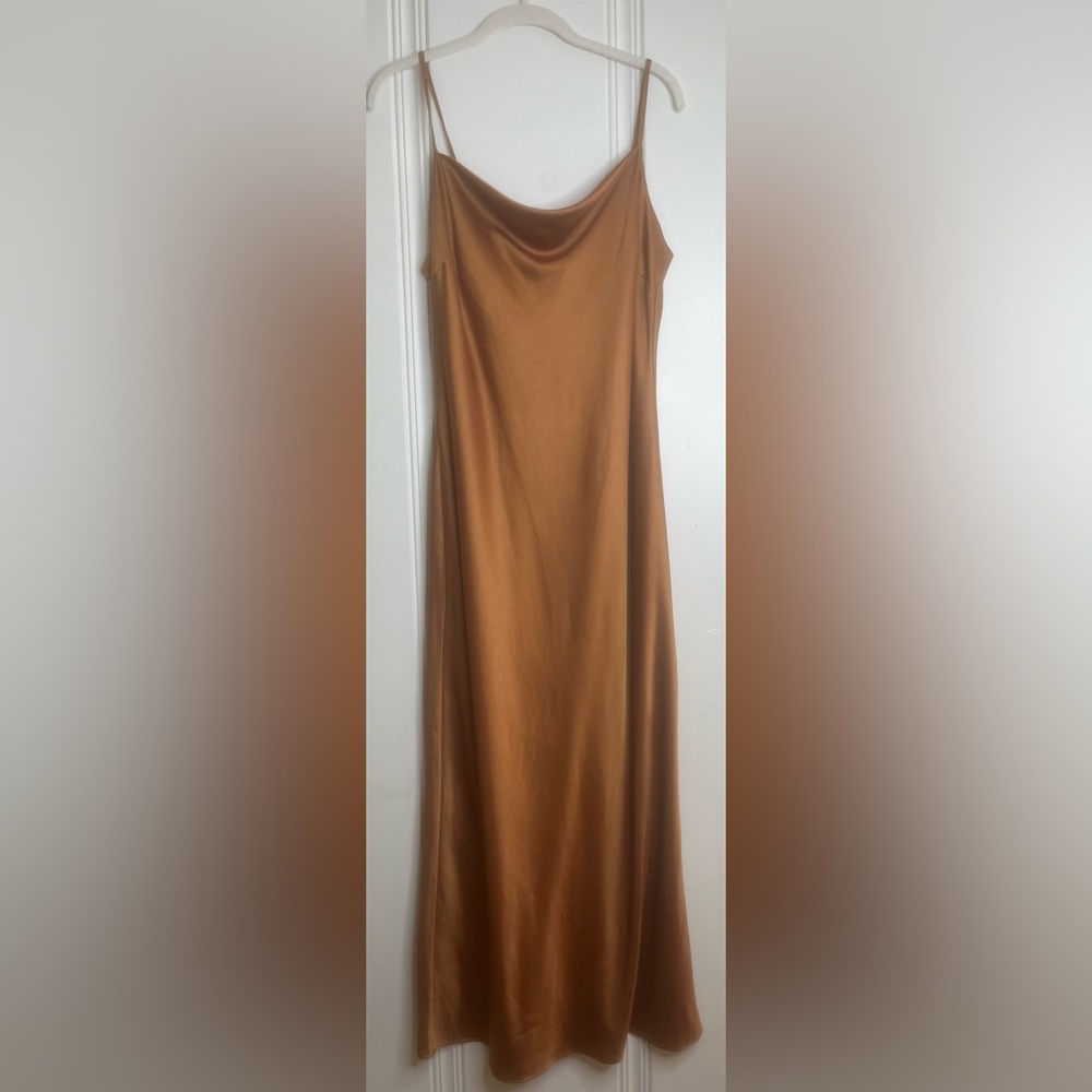 Worn once, pumpkin colored slip. Express.